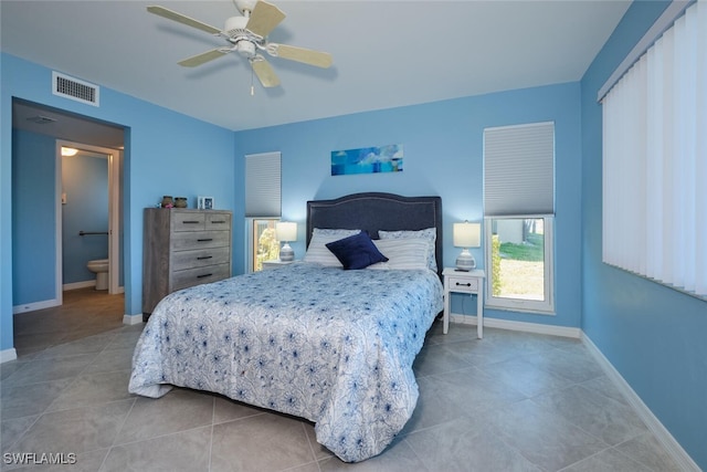 tiled bedroom featuring ceiling fan