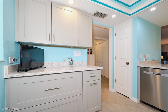 kitchen featuring white cabinetry, dishwasher, light stone countertops, and light tile patterned floors