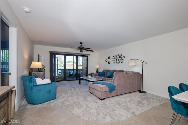 living room with light tile patterned floors and ceiling fan