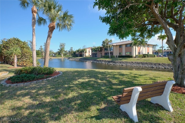 exterior space featuring a water view and a yard