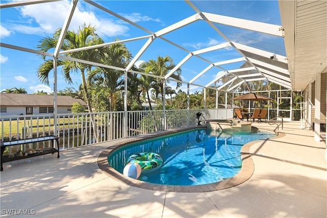 view of swimming pool featuring a lanai, a patio area, and a gazebo