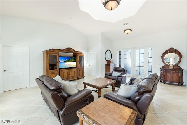 tiled living room with vaulted ceiling and french doors