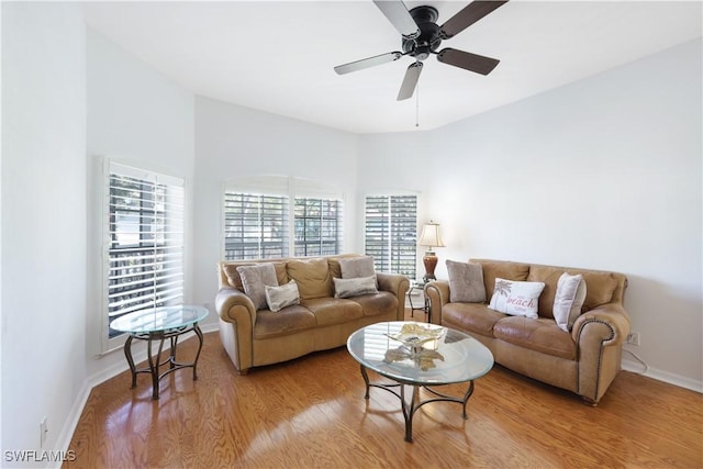 living room featuring ceiling fan and light wood-type flooring