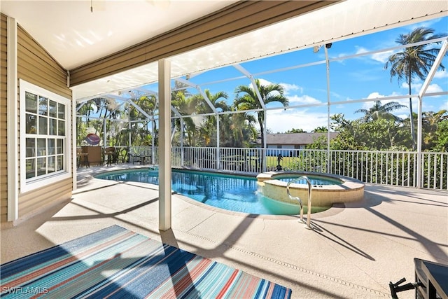 view of pool featuring a lanai, a patio, and an in ground hot tub