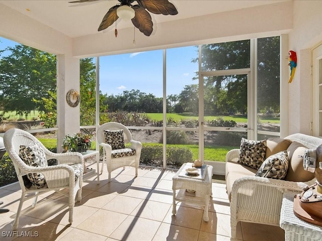 sunroom / solarium with ceiling fan