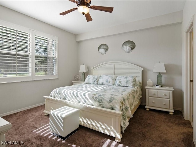 bedroom featuring ceiling fan and dark colored carpet