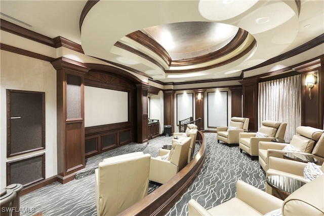 cinema room featuring crown molding and a raised ceiling