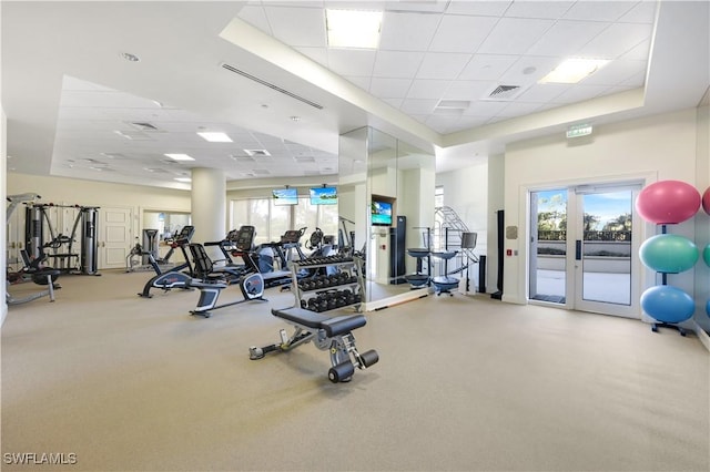 workout area featuring a drop ceiling