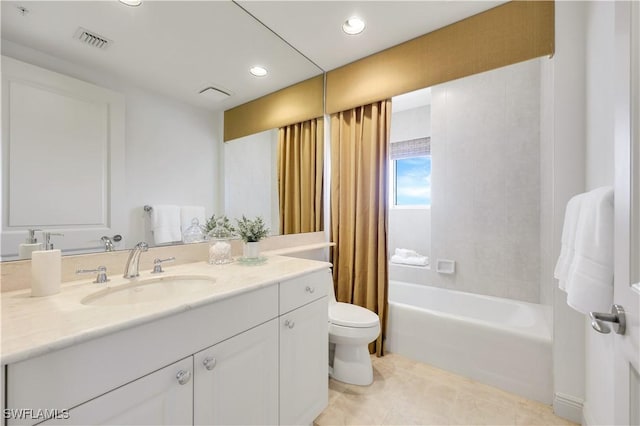 full bathroom with vanity, shower / bathtub combination with curtain, tile patterned floors, and toilet