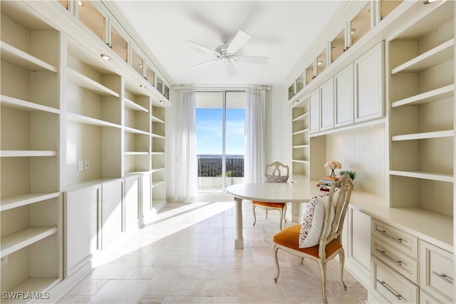 office area with ceiling fan and a wall of windows