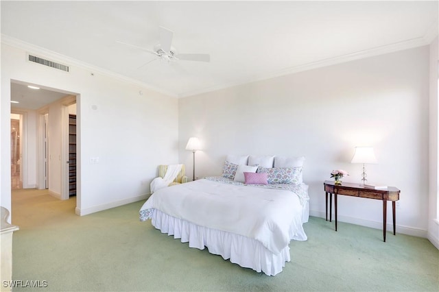 bedroom featuring ceiling fan, ornamental molding, and light carpet