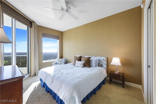 bedroom with light colored carpet and ceiling fan