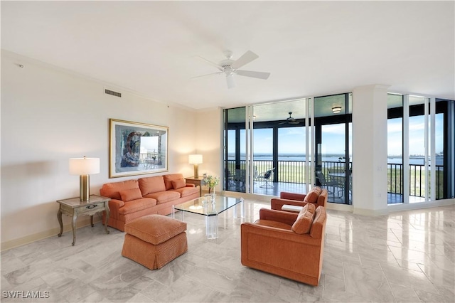 living room featuring a water view, ceiling fan, and floor to ceiling windows