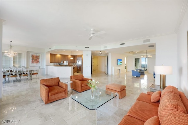 living room featuring ornamental molding and ceiling fan with notable chandelier