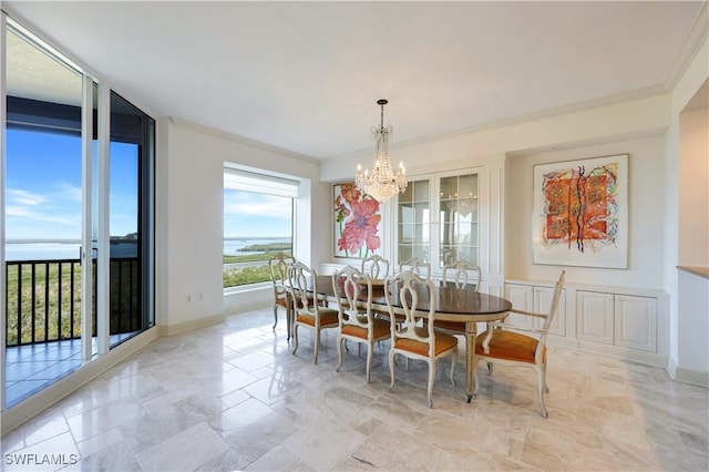 dining area with ornamental molding, floor to ceiling windows, and a notable chandelier