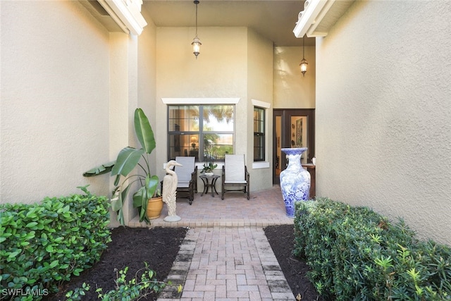 entrance to property featuring a patio