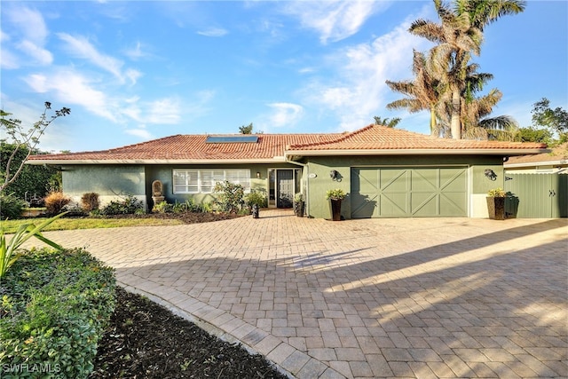 single story home featuring a garage