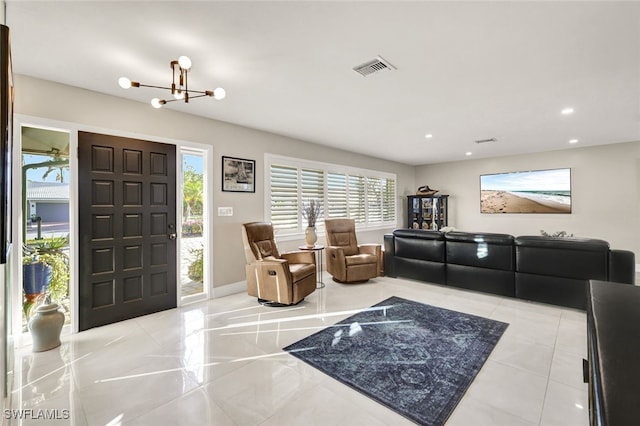 13 Pelican St W, Naples, FL 34113 - living room with an inviting chandelier
