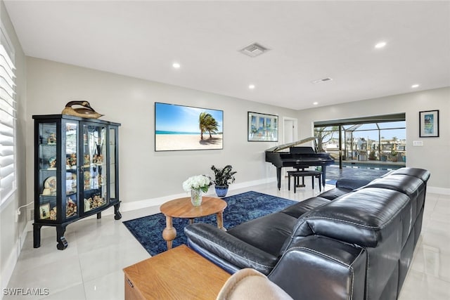 13 Pelican St W, Naples, FL 34113 - living room featuring light tile patterned flooring