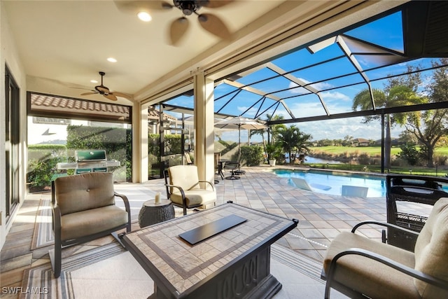 exterior space with ceiling fan, an outdoor hangout area, a patio area, and glass enclosure