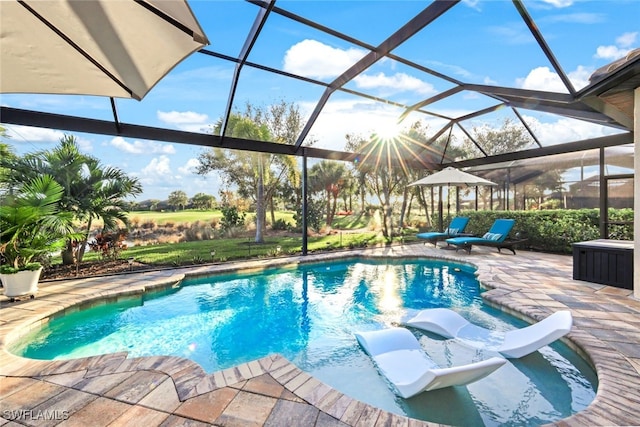 view of pool with a lanai and a patio area