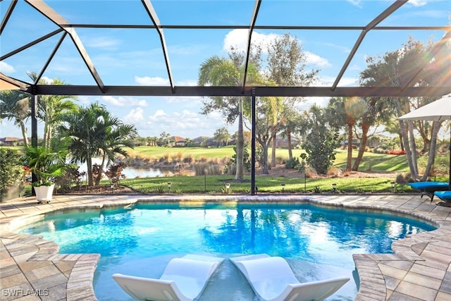 view of pool with a patio, a water view, and glass enclosure