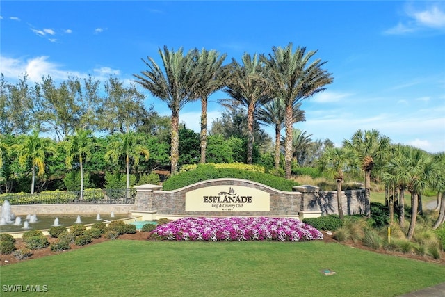 community sign featuring a lawn