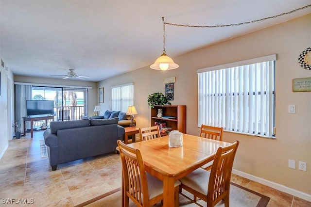 dining space with ceiling fan