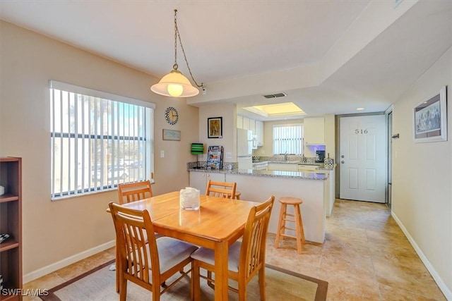 dining space with light tile patterned flooring