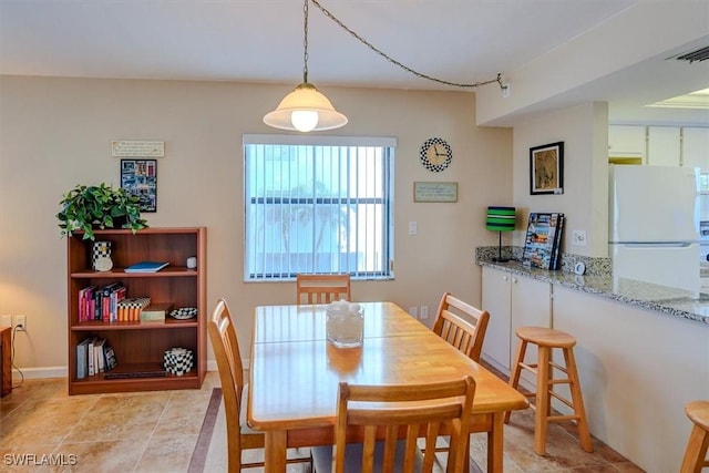 view of tiled dining room