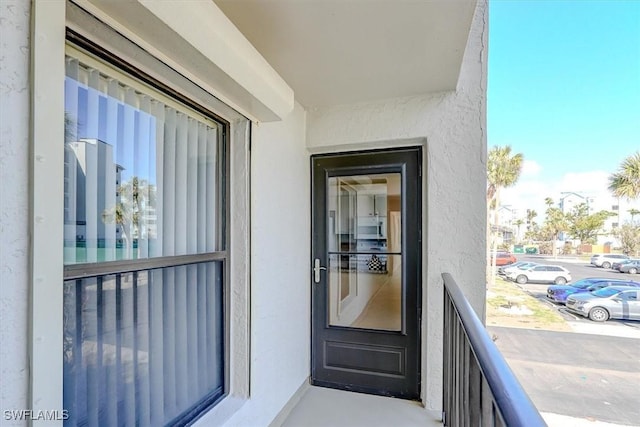 doorway to property with a balcony