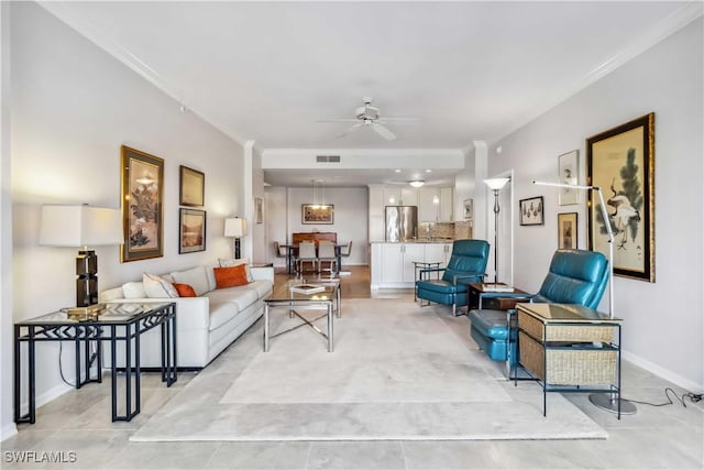 living room with crown molding and ceiling fan