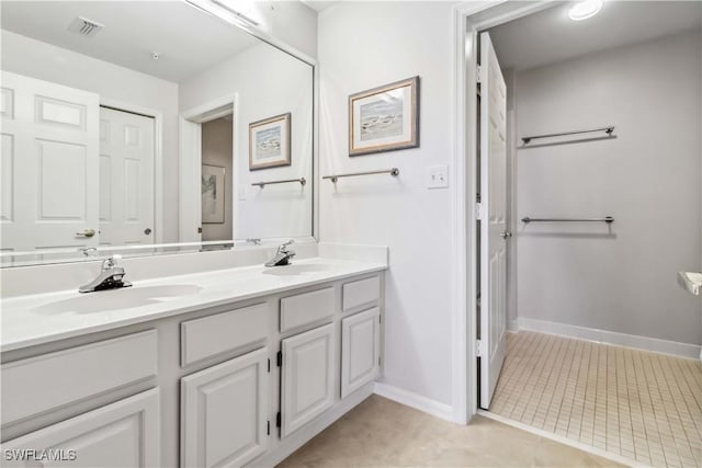 bathroom with vanity and tile patterned floors