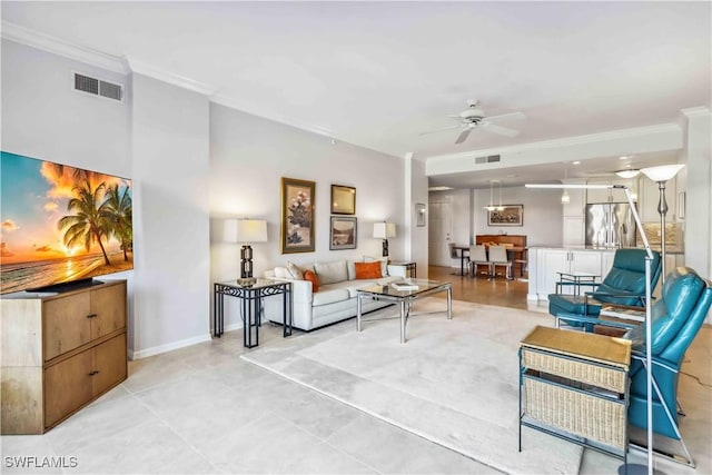 living room featuring crown molding and ceiling fan