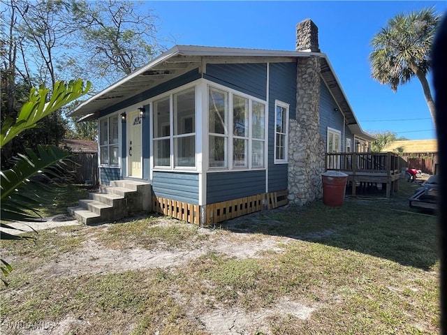 view of home's exterior with a yard