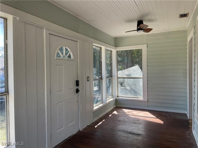 foyer entrance with wood ceiling, dark wood-type flooring, and ceiling fan