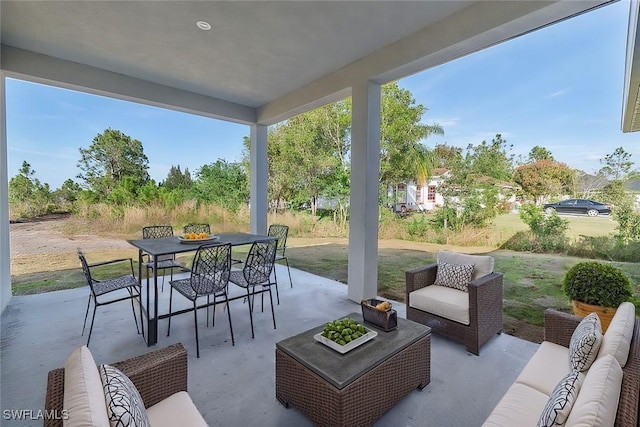 view of patio with outdoor lounge area and outdoor dining space