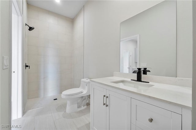 full bath featuring toilet, tile patterned flooring, and vanity