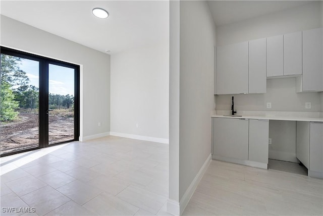 4173 58th Ave NE, Naples, FL 34120 - kitchen featuring light countertops and modern cabinets