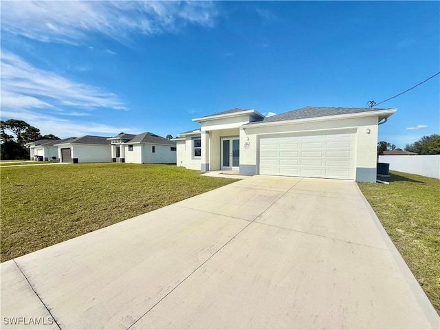 view of front of home featuring a garage and a front yard