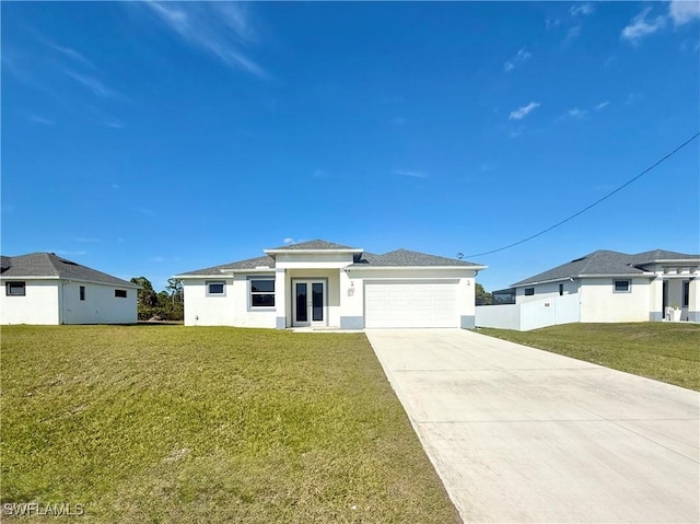 view of front facade featuring a garage and a front lawn