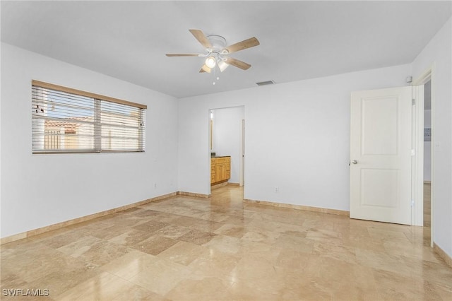 unfurnished room featuring ceiling fan