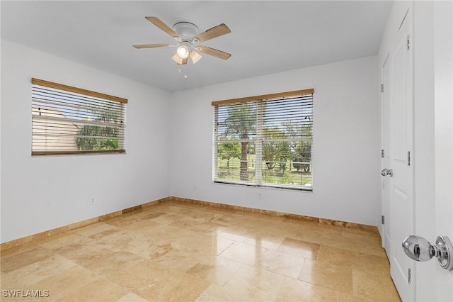 spare room featuring ceiling fan