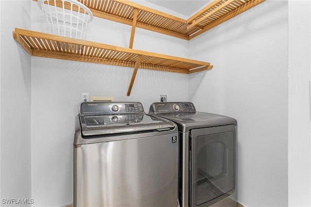 laundry room with independent washer and dryer