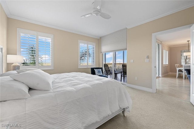 carpeted bedroom featuring crown molding and ceiling fan