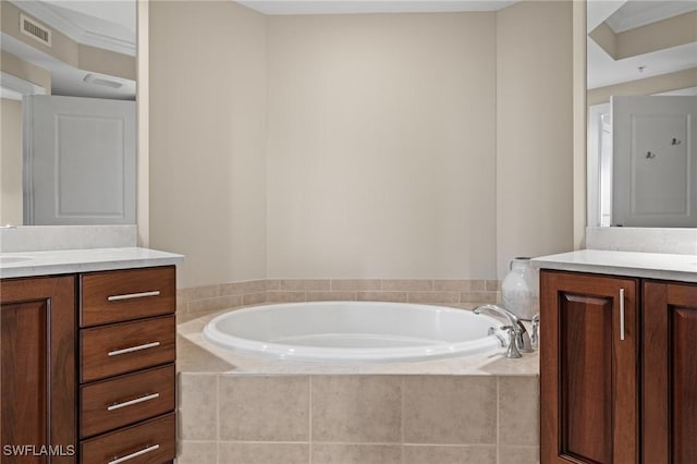 bathroom with vanity and tiled tub