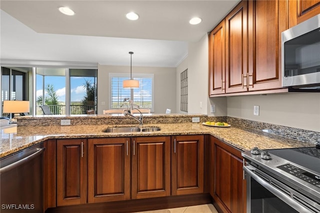 kitchen with light stone counters, appliances with stainless steel finishes, crown molding, and sink