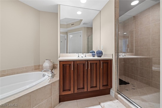 bathroom featuring independent shower and bath, vanity, and tile patterned floors