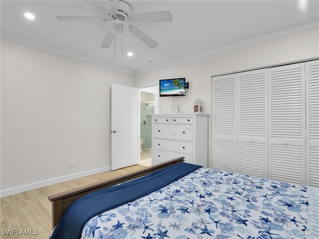 bedroom with ensuite bathroom, hardwood / wood-style floors, ceiling fan, crown molding, and a closet