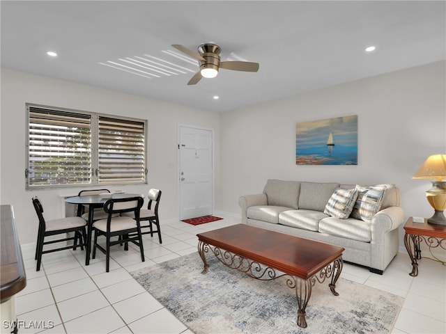 tiled living room with ceiling fan